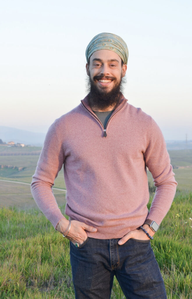 HAR DEV KHALSA smiling outdoors on a large plane of grass