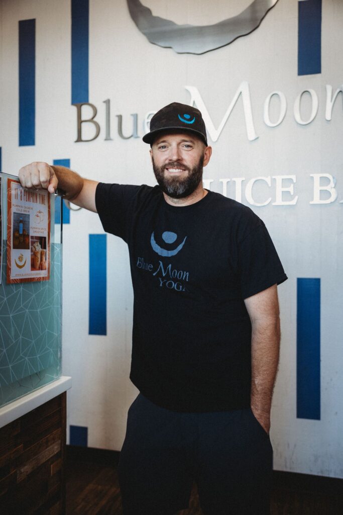 MIKE EASTON MIKE EASTON smiling next to the juice bar