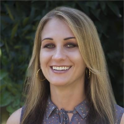 Molly Ohanian smiling outdoors