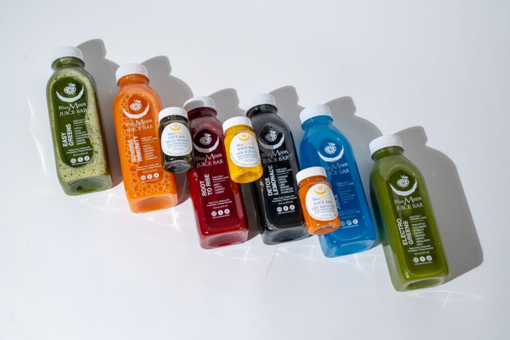 a variety of juice options displayed from Blue Moon Juice Bar